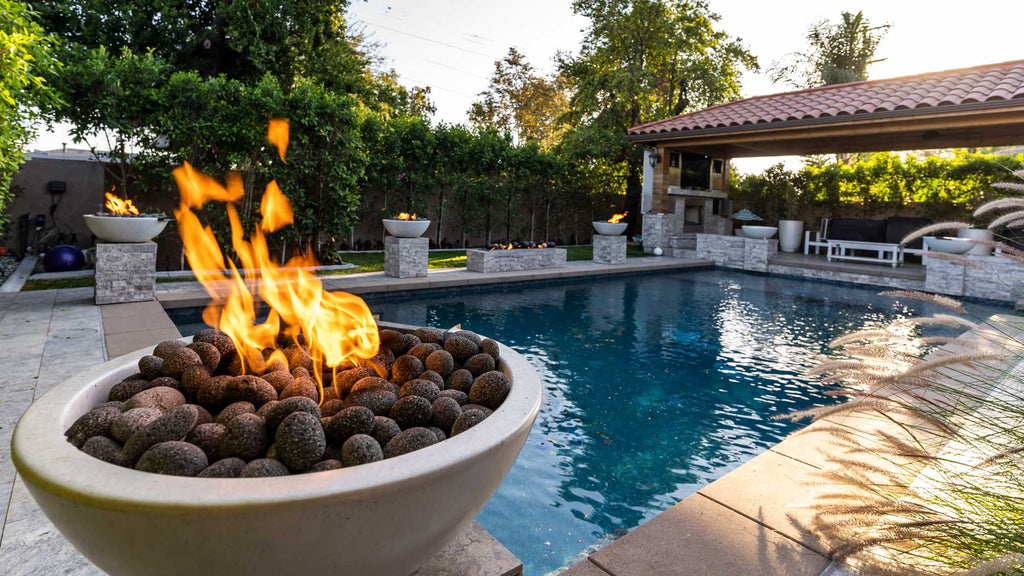 Elevate Your Poolside Experience: Integrating Fire And Water Bowl Features Into Your Swimming Pool Area