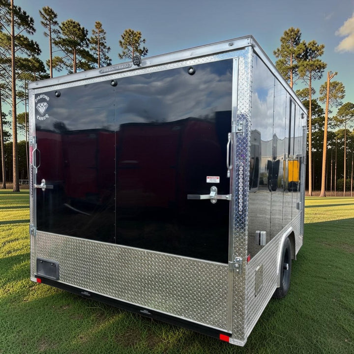 18ft Enclosed Trailer Custom, 8.5 x 18 Black with Chrome ATP with Coin Flooring, Finished Interior, Overhead Cabinet, A/C and Heat strip, and Aluminum Mags